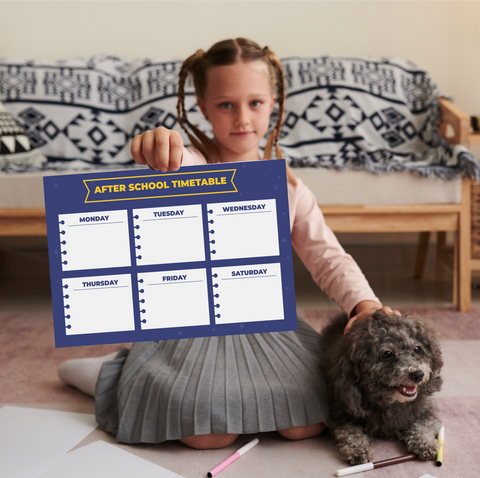 Girl holding wall sticker school timetable