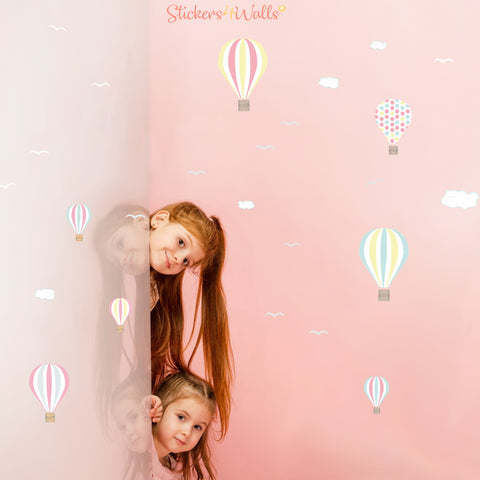 Children in a room with fabric wall stickers