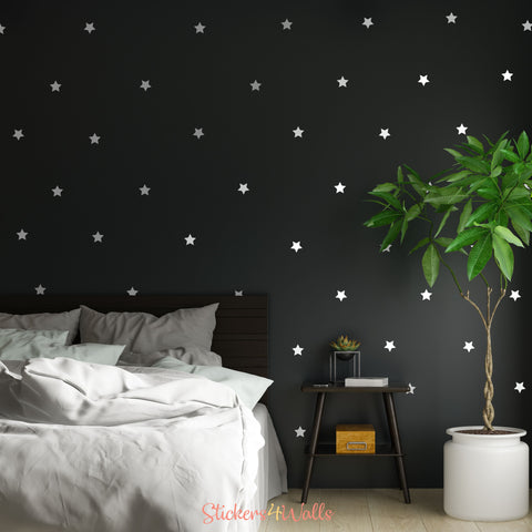 a dark wall with white star wall stickers